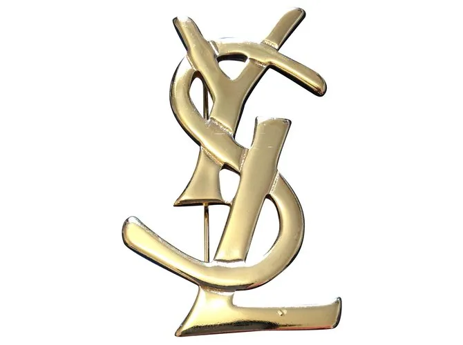 Yves Saint Laurent Alfileres y broches Dorado 