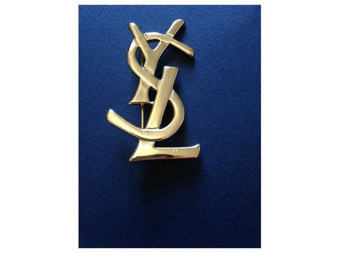 Yves Saint Laurent Alfileres y broches Dorado 